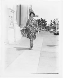 Floral-print belted dress modeled outside the Sonoma County Courthouse in downtown Santa Rosa, California, 1959 (Digital Object)