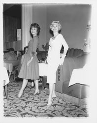 Two models in evening dresses in the &quot;Dramatic Moods&quot; fashion show in the Topaz Room, Santa Rosa, California, 1959 (Digital Object)