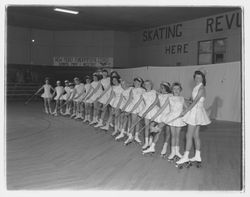 Line of roller skaters with magic wands at the Skating Revue of 1957, Santa Rosa, California, April, 1957 (Digital Object)