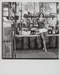 Apple Blossom Queen Julie Pimental posing with apple products, Sebastopol, California, 1977 (Digital Object)