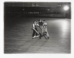 Two male skaters spinning two female skaters aloft in the Skating Revue of 1957, Santa Rosa, California, April, 1957 (Digital Object)