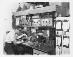 Technician at a workbench in M. L. Bruner Company, Santa Rosa, California, 1964 (Digital Object)