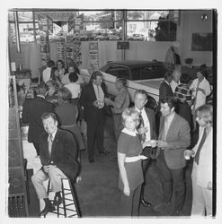 David Zumwalt and attendees at the the Zumwalt Chrysler-Plymouth Center Open House, Santa Rosa, California, 1971 (Digital Object)