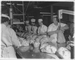 Workers bagging chickens at the California Poultry, Incorporated, Fulton, California, 1958 (Digital Object)
