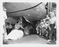 Marie Hindringer, Miss Sonoma County christening an airplane at the Coddingtown Airport, Santa Rosa , California, 1960 (Digital Object)