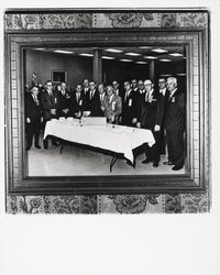 Exchange Bank officials cutting a cake in honor of the 75th anniversary of the bank, Santa Rosa, California, 1965 (Digital Object)