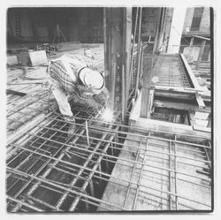 Construction worker welding forms for the second floor in the new Exchange Bank building, 550 Fifth Street, Santa Rosa, California, 1971 (Digital Object)