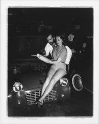 Diane Romero, Miss Sonoma County posing atop a foreign sports car for S.C.C.A. race publicity, Santa Rosa, California, 1957 (Digital Object)