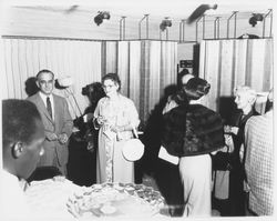 Opening night attendees near the punchbowl at Ceci&#39;s Flamingo Shop, Santa Rosa, California, 1957 (Digital Object)
