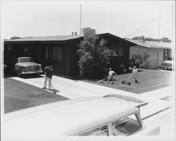 Peck family working in the yard, Santa Rosa, California, 1957 (Digital Object)