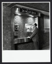 Customer using an Exchange Bank automatic teller machine, Santa Rosa, California, 1980 (Digital Object)