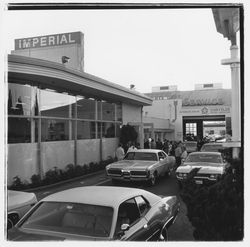 New cars and attendees at the Zumwalt Chrysler-Plymouth Center Open House outside the showroom, Santa Rosa, California, 1971 (Digital Object)