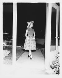 Model with summer blouse, skirt and hat in the Sword of Hope fashion show at the Flamingo Hotel, Santa Rosa, California, 1960 (Digital Object)