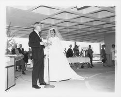 Wedding dress modeled in a fashion show at dedication of parking garage at 3rd and D, Santa Rosa, California, 1964 (Digital Object)