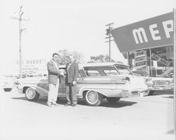 G. K. Hardt and Hugh Codding stand in front of a 1959 Mercury Colony Park station wagon at his G.K. Hardt Lincoln-Mercury dealership, Santa Rosa, California, 1958 (Digital Object)