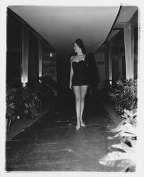 Black one-piece, strapless bathing suit modeled at the Sword of Hope fashion show at the Flamingo Hotel, Santa Rosa, California, June 18, 1960 (Digital Object)