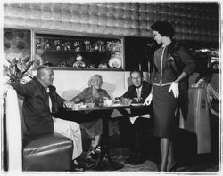 Knee-length skirt and tailored top modeled in the &quot;Dramatic Moods&quot; fashion show in the Topaz Room, Santa Rosa, California, 1959 (Digital Object)