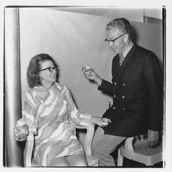 Couple talking at the Zumwalt Chrysler-Plymouth Center Open House, Santa Rosa, California, 1971 (Digital Object)