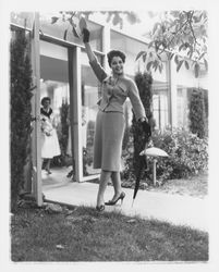 Two-piece jacket and skirt ensemble modeled in the Dramatic Moods of Autumn Fashion Show, Santa Rosa, California, 1959 (Digital Object)