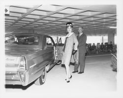 Mid-length herringbone-patterned dress modeled at a fashion show at dedication of parking garage at 3rd and D, Santa Rosa, California, 1964 (Digital Object)