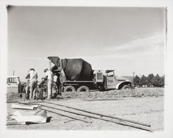 Cement mixer truck of the Santa Rosa Building Materials Co. at a construction site, Santa Rosa(?), California, 1959 (Digital Object)