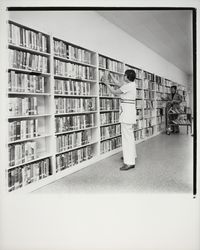 Shelving books at the Geyserville Library, Geyserville, California, 1971 (Digital Object)