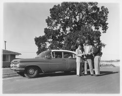 Dutch Flohr and two others standing near a City of Santa Rosa car, Santa Rosa, California, 1959 (Digital Object)
