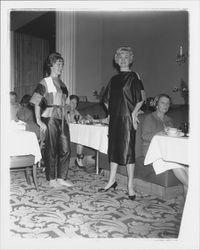 Models in evening wear with geometric patterns and Topaz Room customers in the &quot;Dramatic Moods&quot; fashion show in the Topaz Room, Santa Rosa, California, 1959 (Digital Object)