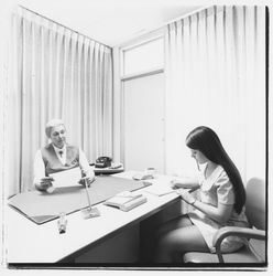 Louise Ederle, administrator, and student in Mrs. Ederle&#39;s office at Luther Burbank College of Commerce, Santa Rosa, California, 1971 (Digital Object)