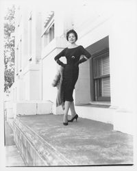 Black cocktail dress and fur stole modeled at the Sonoma County Courthouse, Santa Rosa, California, 1959 (Digital Object)