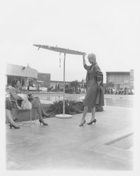 Long coat modeled in the Dramatic Moods of Autumn fashion show, Santa Rosa, California, 1959 (Digital Object)