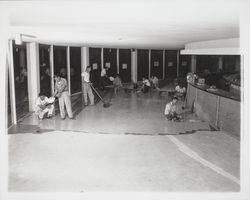 Laying tile floors at the Flamingo Hotel, Santa Rosa, California, 1957 (Digital Object)