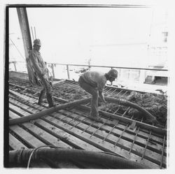 Construction workers pumping concrete into forms for the second floor in the new Exchange Bank building, 550 Fifth Street, Santa Rosa, California, 1971 (Digital Object)