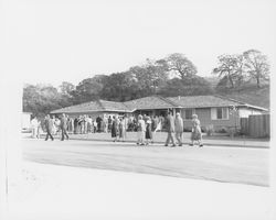 Prospective home buyers lined up in front of a Saint Francis Acres model home at 5802 Monte Verde Drive, Santa Rosa, California, 1958 (Digital Object)