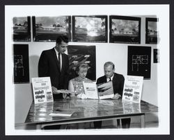 Looking at brochures and plans at Young America&#39;s Oak Lake Green subdivision, Petaluma, California, 1964 (Digital Object)