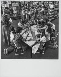 Pam Brown, librarian, with children in the Petaluma Library, Petaluma, California, May 19, 1977 (Digital Object)