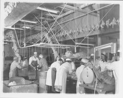 Workers bagging chickens at the California Poultry, Incorporated, Fulton, California, 1958 (Digital Object)