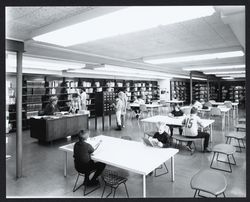 Mrs. Hahn, Librarian, assisting patrons of the Rohnert Park Library, Rohnert Park, California, 1968 (Digital Object)