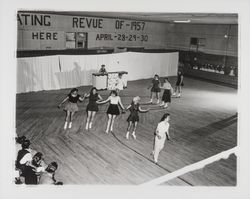 Groups of female skaters circle the floor in the Skating Revue of 1957, Santa Rosa, California, April, 1957 (Digital Object)