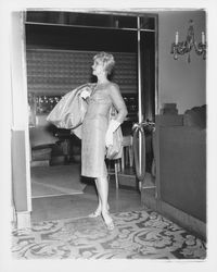 Model in evening dress in the &quot;Dramatic Moods&quot; fashion show in the Topaz Room, Santa Rosa, California, 1959 (Digital Object)