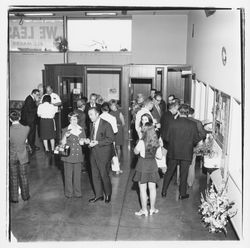 Ed and Elinor Zumwalt and other attendees at the Zumwalt Chrysler-Plymouth Center Open House, Santa Rosa, California, 1971 (Digital Object)