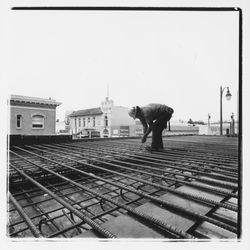 Construction worker clipping forms for the roof of the new Exchange Bank building, 550 Fifth Street, Santa Rosa, California, 1971 (Digital Object)