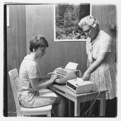 Instructor with a student transcribing from a Stenocord 260 dictation machine at Luther Burbank College of Commerce, Santa Rosa, California, 1971 (Digital Object)